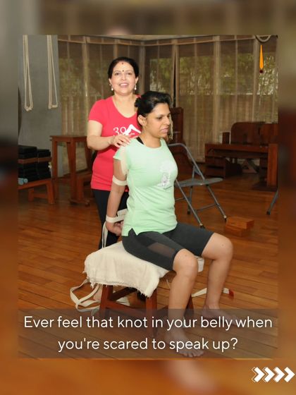 Ever feel that knot in your belly when you're scared to speak up? That's a blockage in your Manipura chakra. Here, a student uses a chair and belt to open her shoulders and chest, releasing tension and building the confidence to find her voice.