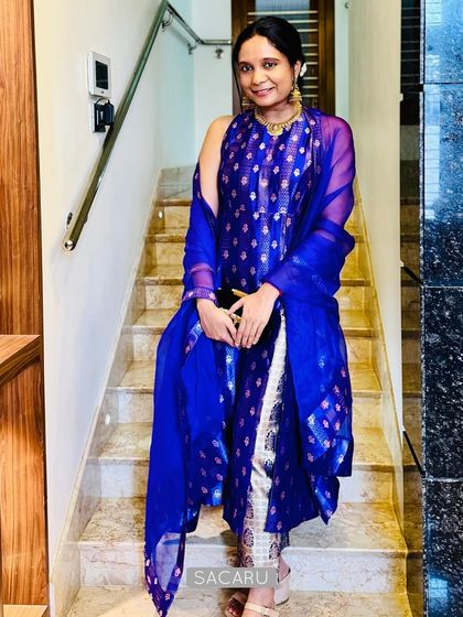 A full-length view of Pallavi's glamorous Indo-western outfit, perfect for a festive evening.