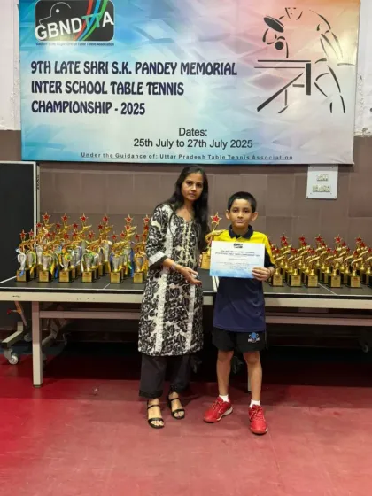 Our U-11 boys' gold medalist, Aryaveer Borah, with his certificate and trophy.
