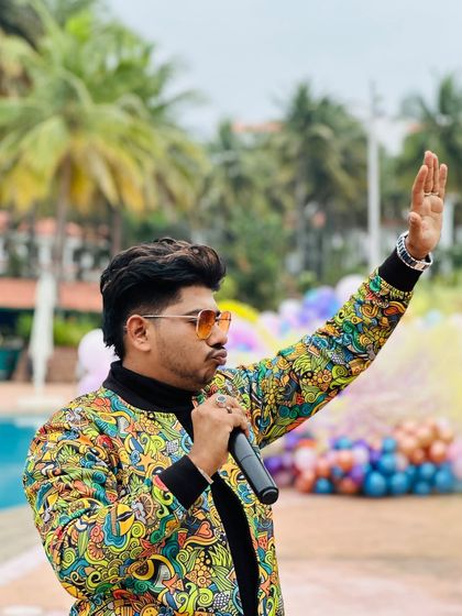 Raising my hand to get the crowd's attention at a pool party. It's all about commanding the space and guiding the energy of the event.