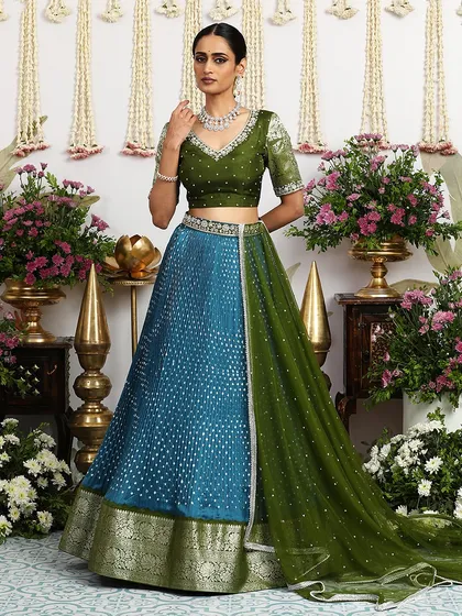 The full ensemble, with the dupatta elegantly draped, showcases the rich textures and colors of this beautiful outfit.
