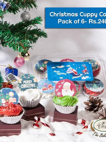 A pack of six Christmas 'Cuppy Cakes', which are our festive plum muffins with colorful frosting and themed toppers.