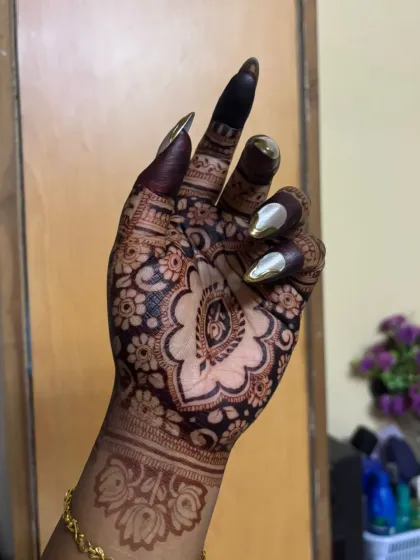 A close-up showing the intricate details of her party mehndi.