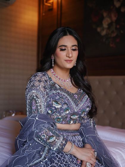 Another angle of this lavender lehenga look. The soft shimmer on the eyelids catches the light beautifully.
