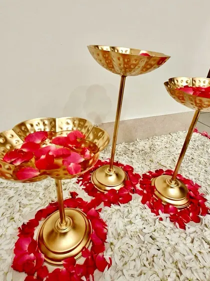 A duplicate image of the elegant brass stands used for a housewarming, perfect for adding a touch of tradition.