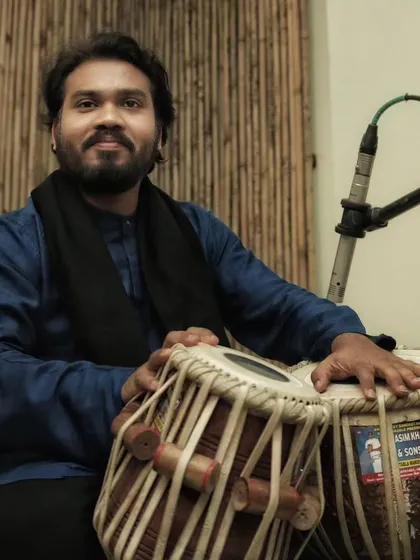 A series of photos from a baithak-style concert in Delhi with sarod player Pratik Shrivastav bhai. The intimate setting allows for a deeper connection with the audience.