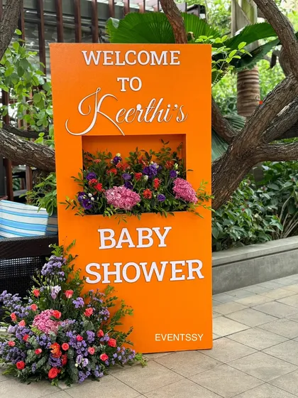 A custom welcome sign for the baby shower, featuring a built-in floral box. This was placed at the entrance to greet guests and introduce the event's theme and color palette.