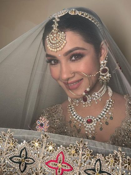 A peek from behind the dupatta. This shot is all about the eyes, which are beautifully defined yet soft, and the overall glowing complexion.