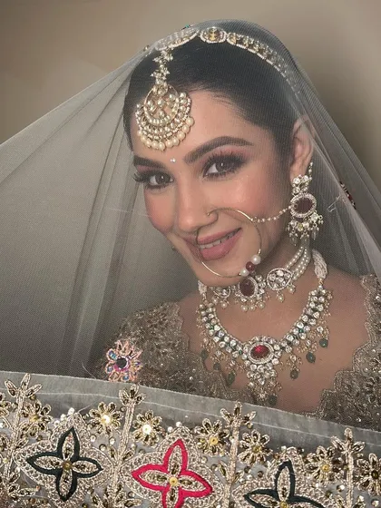 A peek from behind the dupatta. This shot is all about the eyes, which are beautifully defined yet soft, and the overall glowing complexion.