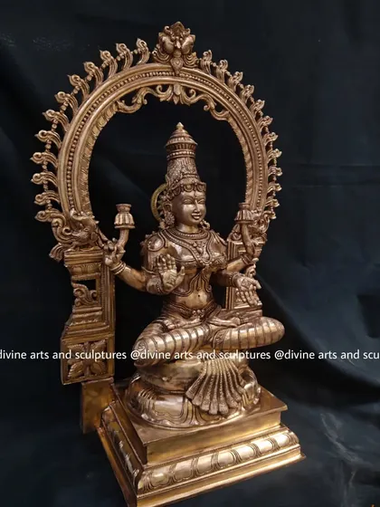 A side view of the 23-inch Mahalakshmi, showing the depth of the sculpture and the fine details on the pillars of the arch.