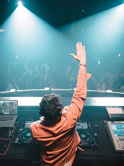 A view from behind the decks at Hammerzz in Goa, waving to the energetic crowd.