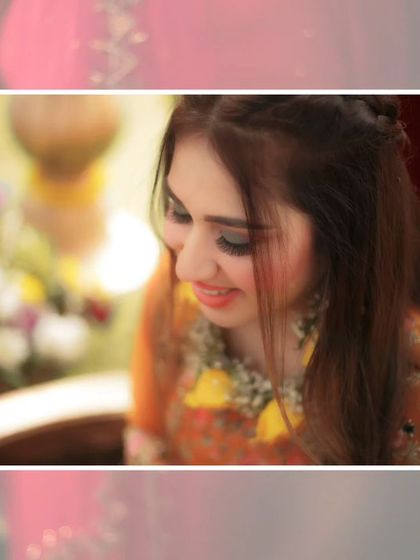 A close-up of the bride, Nisha, smiling softly, her floral jewelry and the warm tones of the event creating a beautiful portrait.