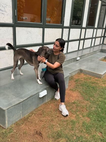 Piku learning to relax on the steps of the center, a place she once found intimidating.