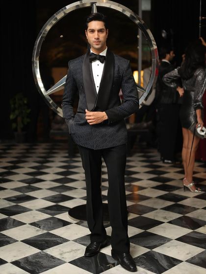 The Labyrinth Tuxedo, featuring a subtle geometric pattern on a dark base. This is an elegant choice for formal nights and corporate galas.