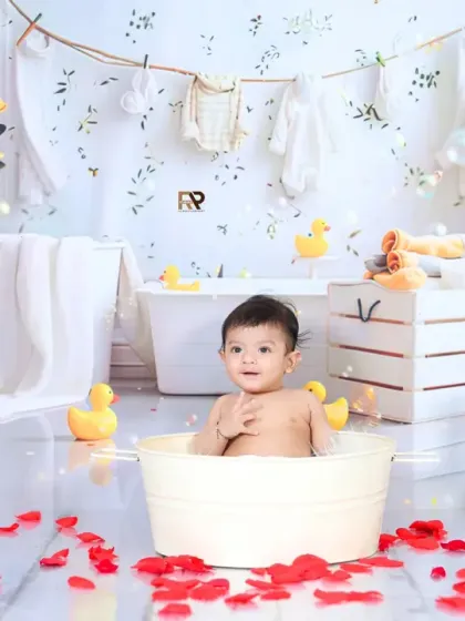 A wide shot of the half-birthday splash setup, showing the full arrangement of props and decorations. This photo highlights the detail and creativity that goes into each session.