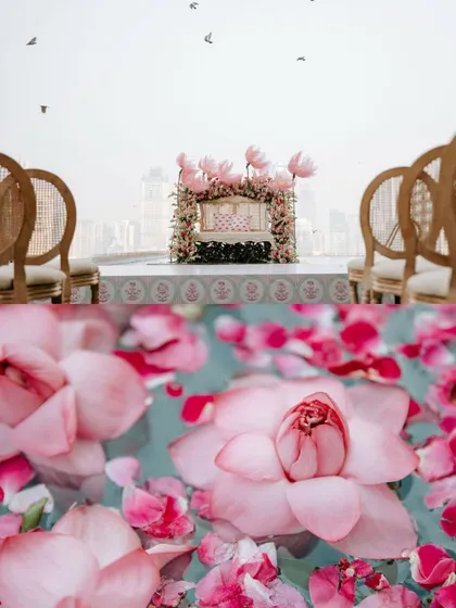 A creative shot combining the distant view of the floating stage with a close-up of real lotus flowers and petals in the pool.