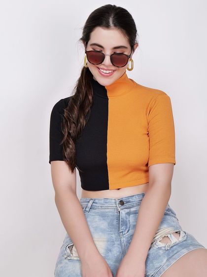 A close-up shot focusing on the fit and color of the crop top, with the model's pose adding a touch of personality.