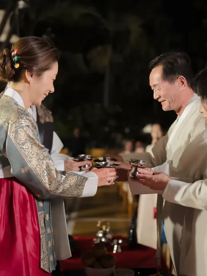 A key part of the Paebaek is honoring the elders. Here, the bride serves tea to her new parents-in-law, a beautiful moment of respect and union that I carefully orchestrate.