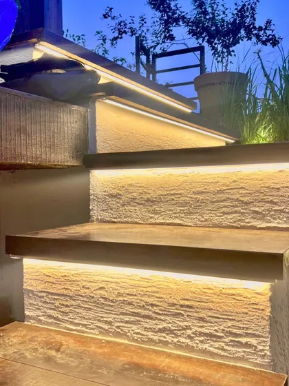 Lighting is key, even outdoors. We used integrated LED strips under the risers of these outdoor steps to enhance safety and create a beautiful, glowing effect in the evening.