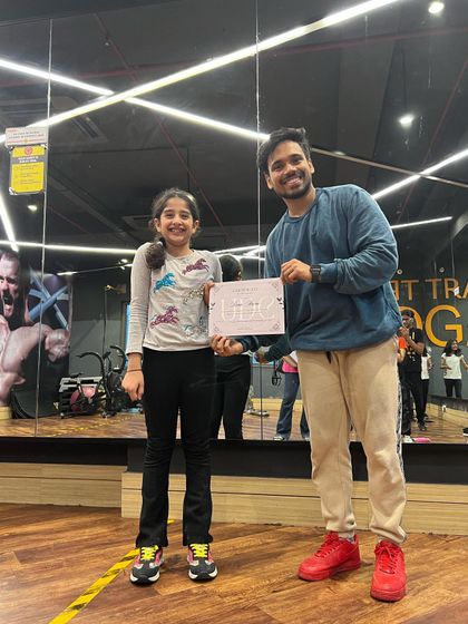 Another happy student receiving her certificate. These achievements are a testament to the hard work and practice our dancers put in every week.