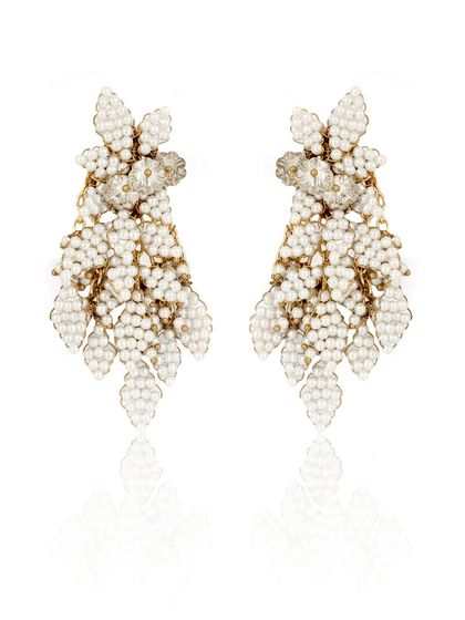 Modernity in every detail. These white beaded leaf-motif earrings are designed for the woman of today.