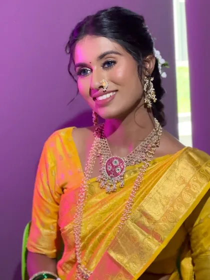 A happy, smiling portrait of the bride, her makeup looking bright and fresh.