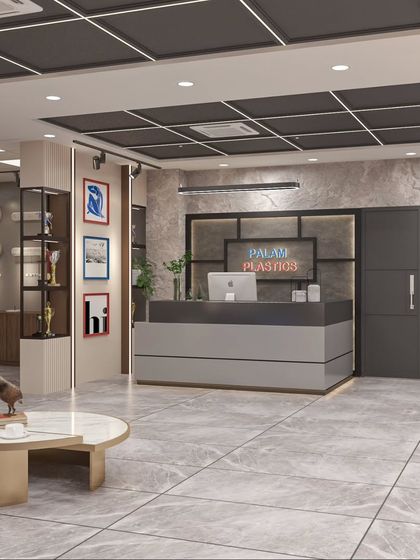 The reception area for Palam Plastics, featuring a modern grey desk, marble-look flooring, and a display area for awards, creating a strong first impression.