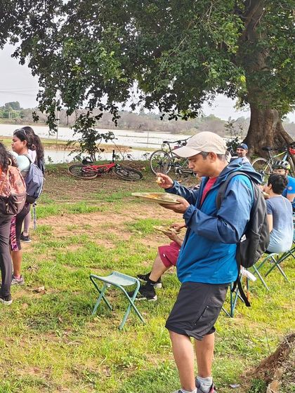 We take our picnics seriously! Here, riders enjoy a well-deserved meal with a view, served by our support team.