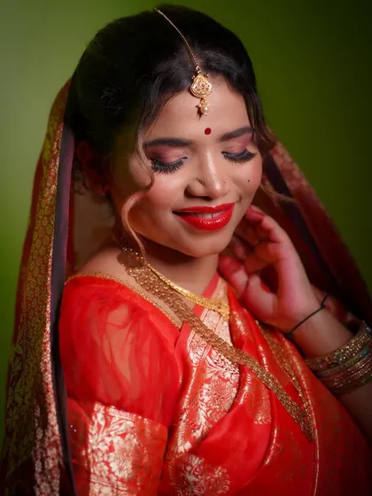 A classic bridal look with a bold red lip and soft, shimmery eyes. This is the kind of timeless elegance I teach my students to create for any bride.