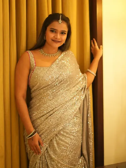 A portrait shot in my glittering silver saree before hosting a Sangeet night.
