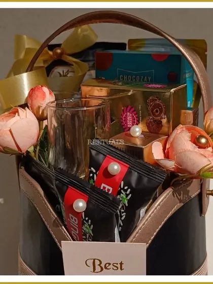 A different view of the classic 25th-anniversary hamper, showing the variety of gourmet chocolates and snacks included.