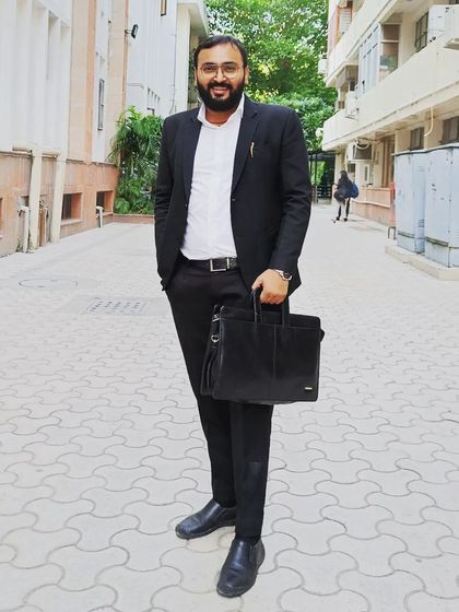 A moment of focus within the court premises. Navigating the justice system requires persistence and a deep understanding of the legal environment, which I bring to every case.