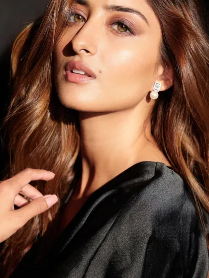A close-up from the "three moods" series. This shot uses soft, direct light to create a classic beauty portrait, highlighting the makeup and the model's features.
