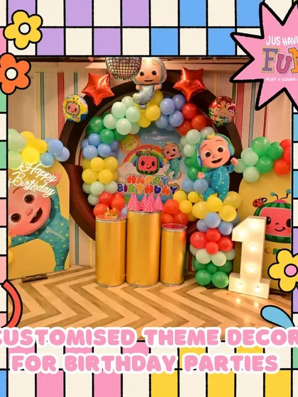 A Cocomelon theme is perfect for a first birthday. This setup features custom decor with characters from the show, a colorful balloon arrangement, and a light-up number "1" to mark the special milestone.