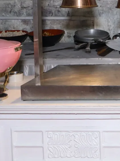 A behind-the-scenes look at our Italian food station setup. The stainless steel equipment and copper heat lamps ensure every dish is served at the perfect temperature.