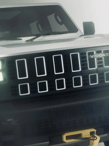 A close-up of the Mahindra Vision T concept, focusing on the unique design of the headlights and grille. This type of detail shot is crucial for launch campaigns.
