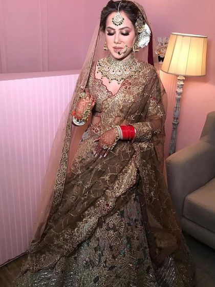 A full shot of the bride looking absolutely graceful in her traditional bridal attire.