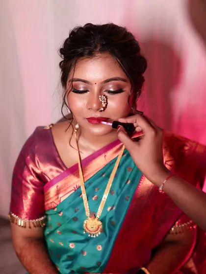 The final touch. Applying a soft lip color to complete a makeup look that is all about enhancing my bride's natural features.