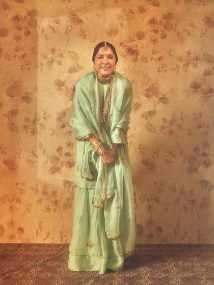 The graceful Neena Gupta, also styled for the music video 'Dastoor'. She is wearing a beautiful mint green sharara set with traditional jewelry, creating a timeless and elegant look.