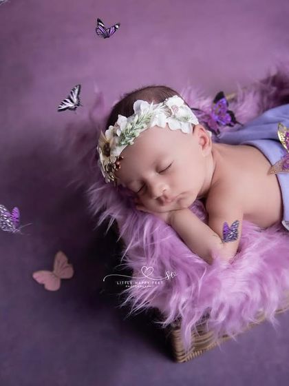A little angel surrounded by butterflies. The purple theme is magical, and the floating butterflies add a sense of wonder and movement to the image.
