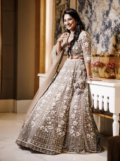 A happy and relaxed solo portrait of the bride-to-be, showcasing her beautiful smile and outfit.