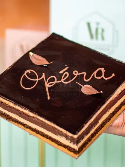 Our French Opera cake is a timeless classic. It features layers of almond sponge, coffee buttercream, and chocolate ganache, creating a perfect harmony of flavors that offers a moment of pure indulgence.