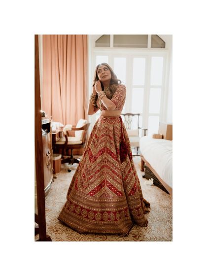 A candid moment of the bride getting ready in her hotel room. This behind-the-scenes shot captures the final touches and her anticipation before the wedding.