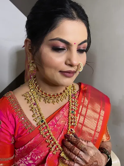 A close-up of the Munj makeup, showing the detailed eye work and flawless skin.