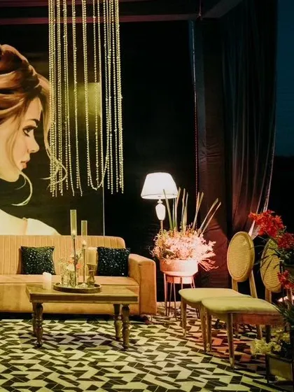 Another view of this chic lounge, showcasing how the custom art panel and soft lighting create a sophisticated and inviting atmosphere. It’s the perfect blend of comfort and high-end cocktail party design.