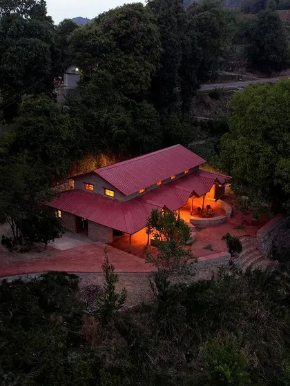 **Sargakhet Handicraft Centre, Uttarakhand:** An evening view of a British-era post office we restored and adapted into a community hub. This project in the Mukteshwar valley embodies our commitment to preserving heritage while creating sustainable economic opportunities for local artisans.