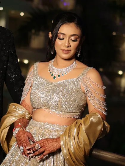 This shot captures the bride's full Sangeet look, with her hands adorned with beautiful henna.