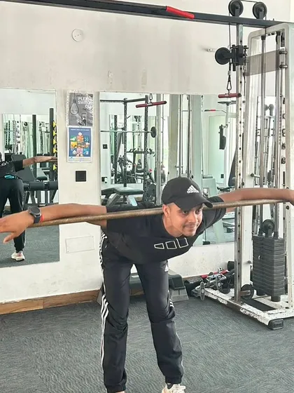 Emphasizing proper form during a hamstring and back stretch.