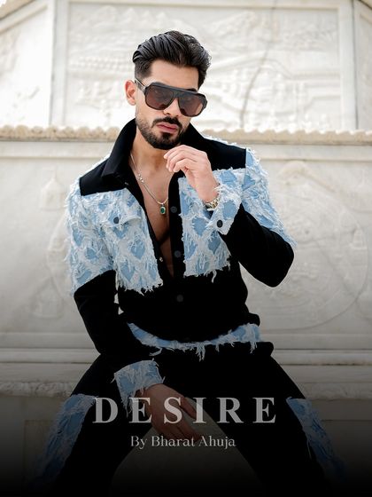 A seated pose that exudes confidence. The black and denim co-ord set is for the man who is bold, refined, and unapologetic.