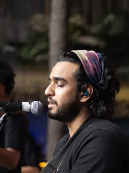 Our guitarist, lost in the music. The concentration and passion of our artists are what make our live band so special.